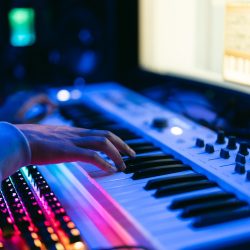 close-up-sound-producer-hands-working-at-studio.jpg